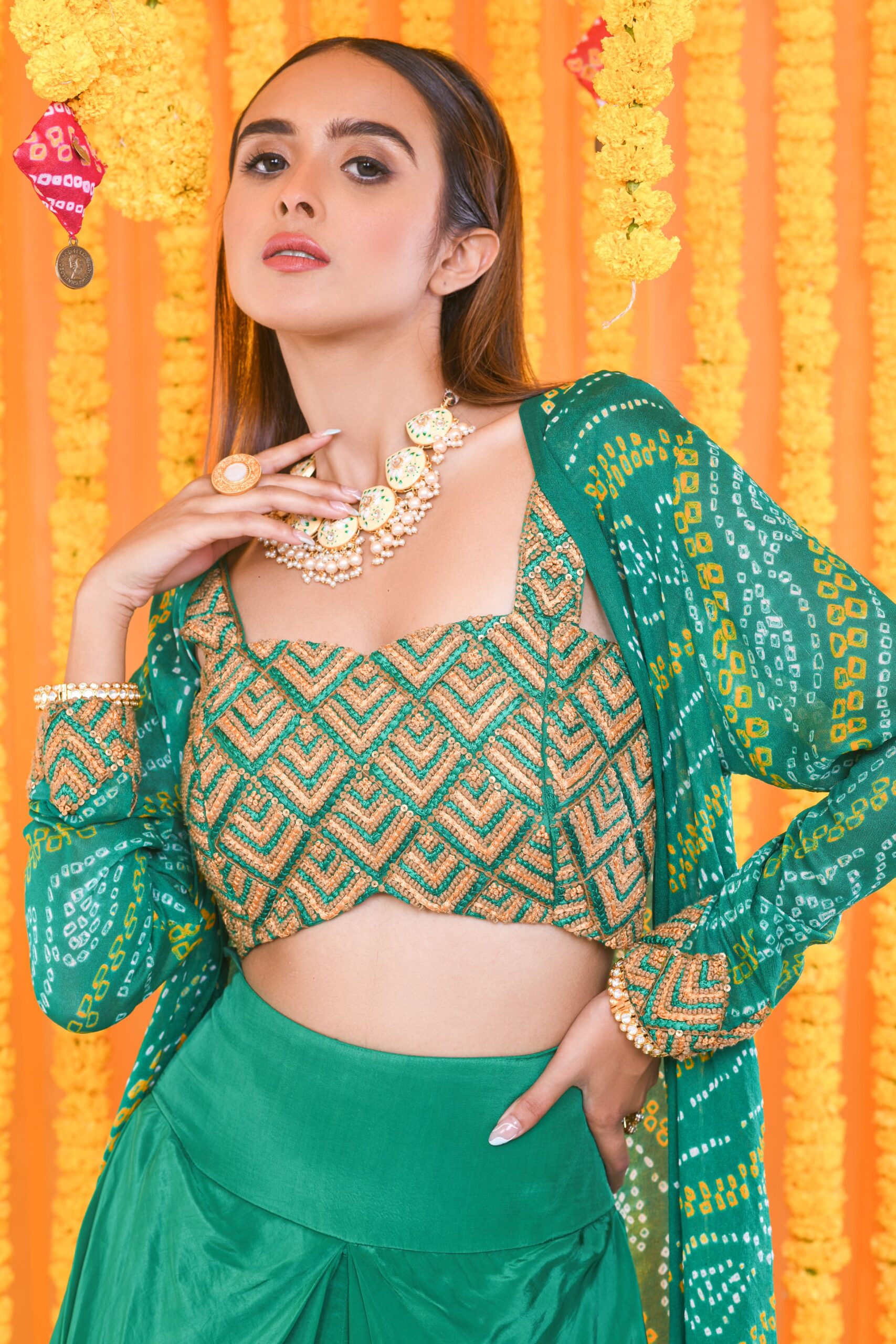 GREEN BANDHNI CAPE AND HAND EMBROIDERED BUSTIER WITH DRAPE DHOTI SKIRT - Image 2