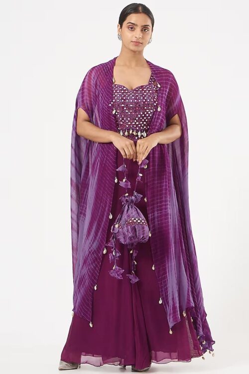 CROP TOP WITH FLARED PANTS AND  A LONG CAPE.