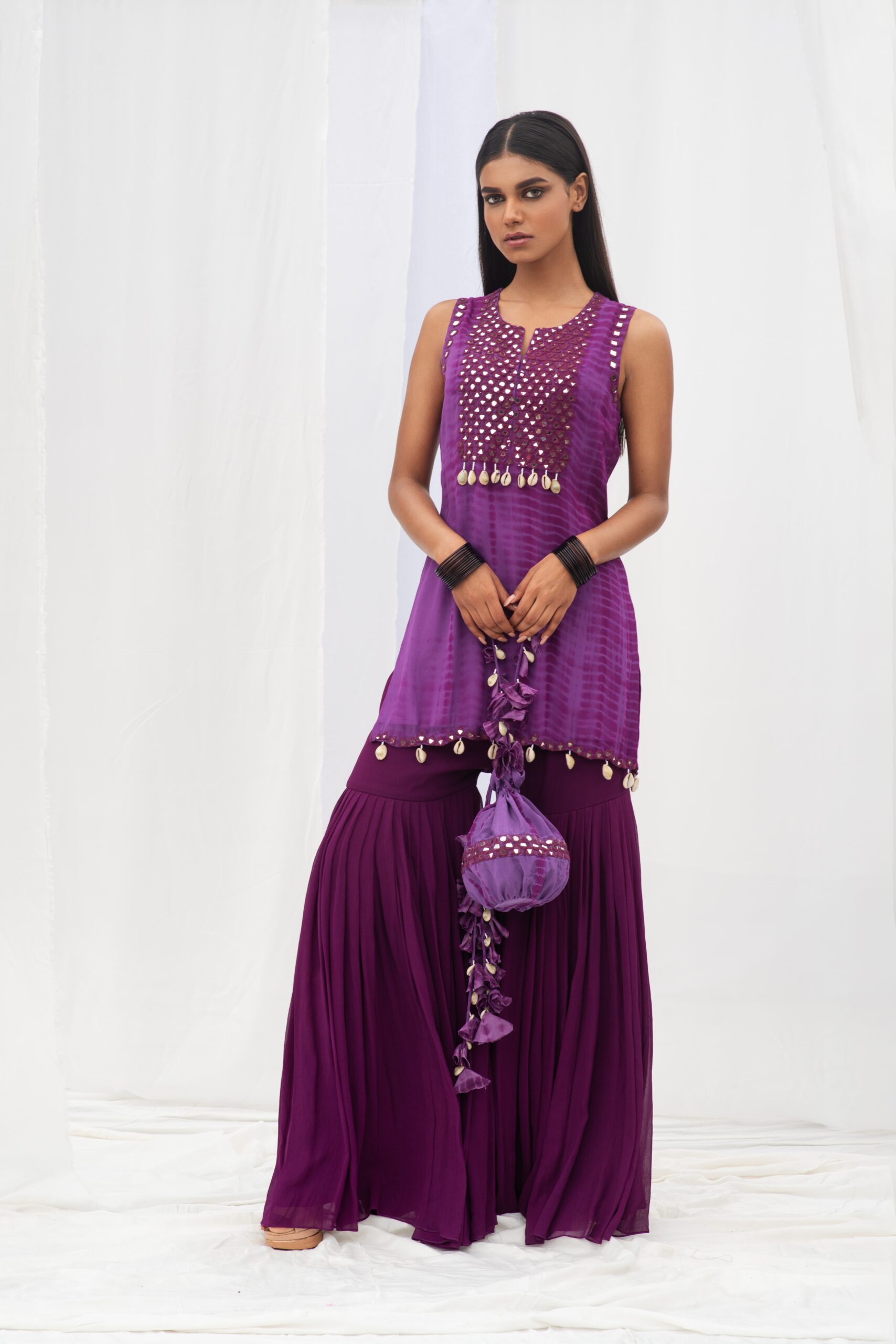 VIBRANT SHORT KURTA PAIRED WITH A STYLISH GARARA AND DUPATTA. - Image 6