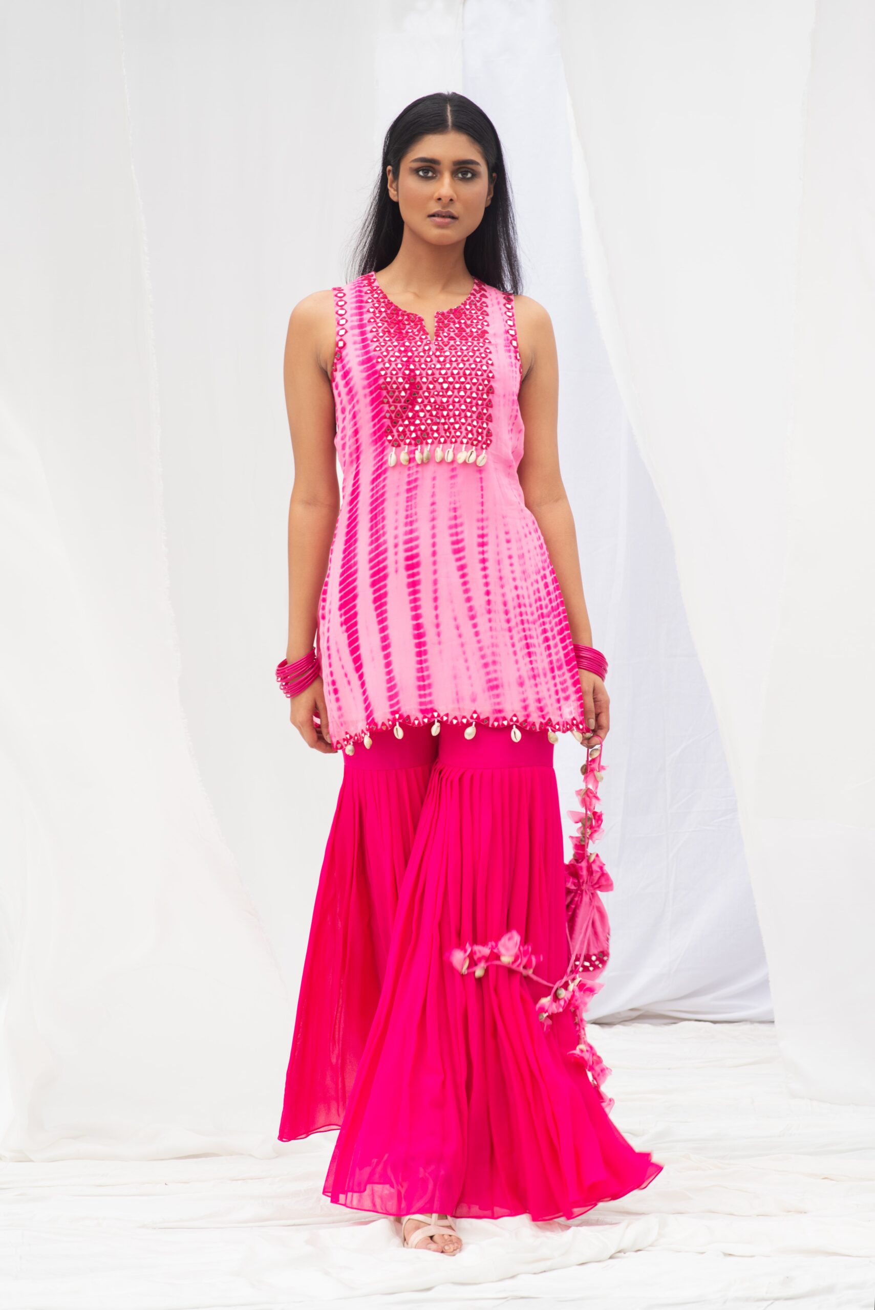 VIBRANT SHORT KURTA PAIRED WITH A STYLISH GARARA AND DUPATTA. - Image 9