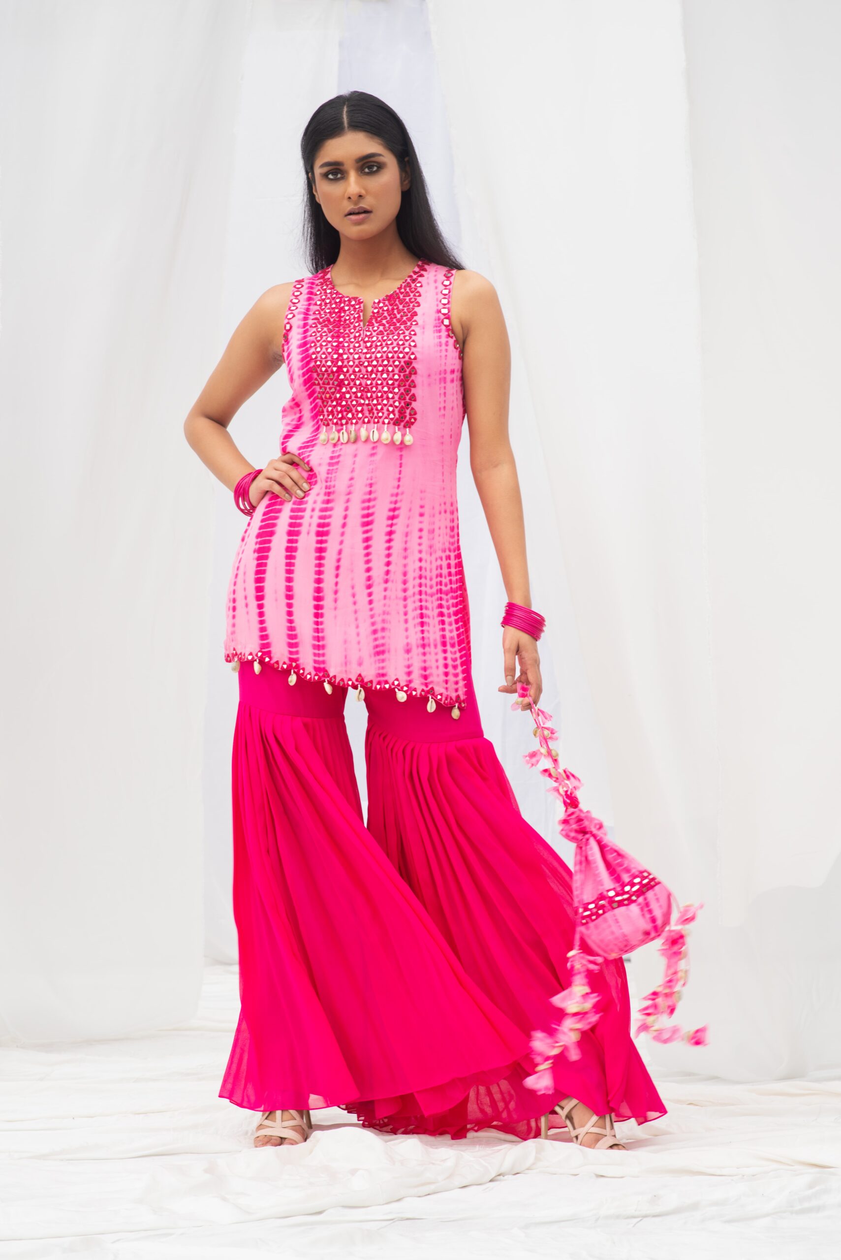 VIBRANT SHORT KURTA PAIRED WITH A STYLISH GARARA AND DUPATTA. - Image 10